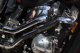 Fototapeta  - Shiny chrome motorcycle engine block Chopper.