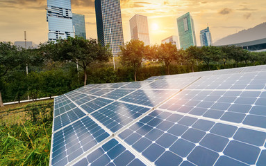 Wall Mural - ecological energy renewable solar panel plant with urban landscape landmarks