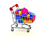 © 9lnw - Toy building construction block bricks for kids in a shopping cart isolated on white background