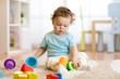 © Oksana Kuzmina - baby kid toddler playing toys at home or nursery