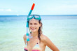 Beautiful young woman in a snorkeling mask on a background of azure sea, traveling to southern tropical countries