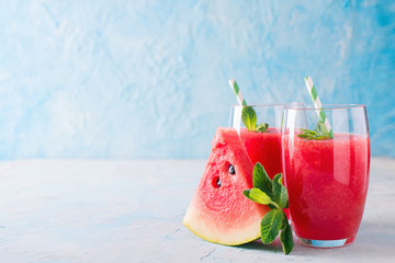 Wall Mural - Watermelon smoothie with slice of fruit and leaf of mint