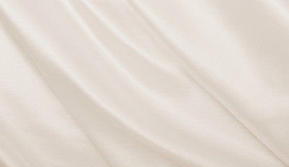 smooth elegant golden silk or satin luxury cloth texture as wedding background. luxurious christmas 