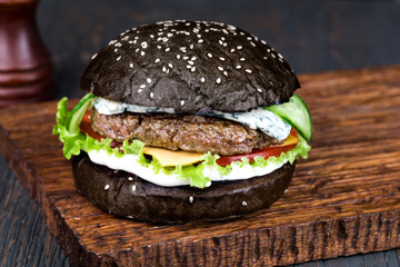 Canvas Print - Burger on a wooden board