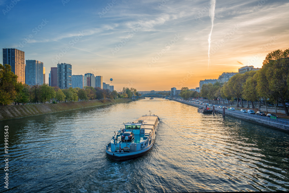 Barge on the river Seine at sunset, Paris France - obrazy, fototapety, plakaty 