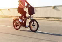 A Young Woman Riding An Electric Bicycle