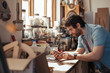 © mavoimages - Young woodworker using a tablet in his workshop