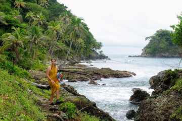 Wall Mural - Tourist returning from diving on wild coast of the Caribbean sea. Colombia