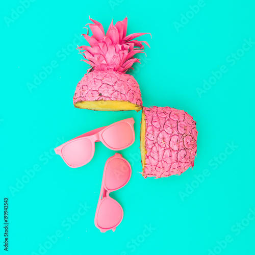 Fotografia, Obraz two painted in pink color halfs of the pineapple of which fall sunglasses
