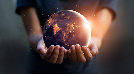 earth at night was holding in human hands. earth day. energy saving concept, elements of this image 