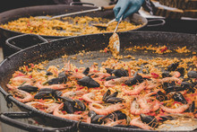 Traditional Paella With Sea Food And Vegetables At Street Food Market