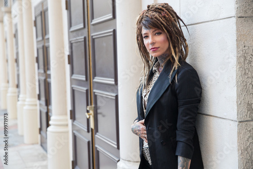 Businesswoman Wearing Suit With Tattoos And Dreadlocks Buy