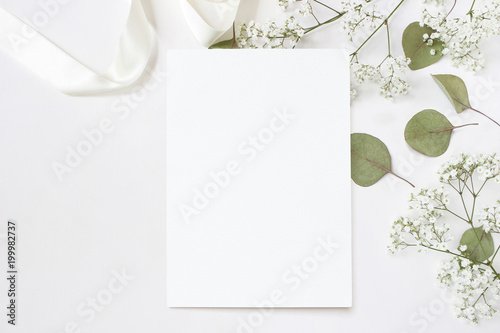 Download Styled Stock Photo Feminine Wedding Desktop Stationery Mockup With Blank Greeting Card Baby S Breath Gypsophila Flowers Dry Green Eucalyptus Leaves Satin Ribbon And White Background Empty Space Buy This Stock Photo PSD Mockup Templates