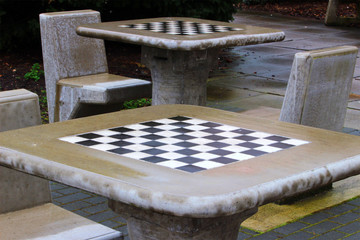 Outdoor chess table on a wet spring morning