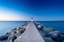 Evening Landscape With A Pier And A Lighthouse In Empuriabrava, Spain