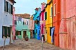 Vibrant street with laundry on the colorful island of Burano near Venice, Italy