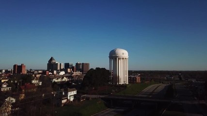 Wall Mural - Greensboro skyline descending into the grass