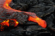 Hot magma escapes from an earth column as part of an active lava flow, the glowing lava slowly cools and freezes - Location: Hawaii, Big Island, volcano 