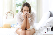 Ill Woman Coughing In An Hotel On Vacations