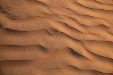 Wave Patterns In The Shifting Red Sands Of The Omani Desert