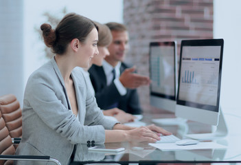 Canvas Print - business team discussing financial charts on a workplace