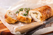 © murziknata - Chicken roll and vegetables on a table. Selective focus. Copy space