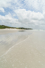 empty seashore under blue sky with clouds, Rarawa beach, New Zealand