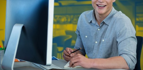 Wall Mural - Composite image of portrait of businessman using computer at