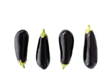 Aubergines With Water Drops On White Background