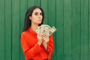 Funny Casual Girl Holding Money Thinking to Invest