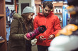 © Wavebreak Media - Couple selecting shoe in a shop