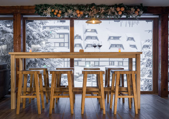 Wall Mural - bar and stools next to window on winter holiday