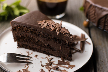 chocolate cake on wood background.