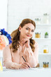 © LIGHTFIELD STUDIOS - beautiful woman sitting with notebook and pencil at table in kitchen