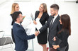 © ASDF - handshake of business partners after signing the contract