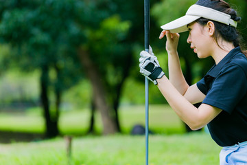 Asian woman play golf