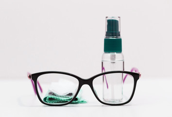 Glasses, napkins, liquid in a bottle, white background