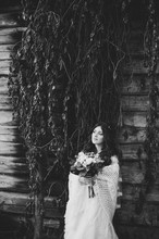 Stylish Beautiful Bride With Wedding Bouquet In Nature