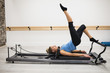 © Wavebreak Media - Woman exercising on reformer