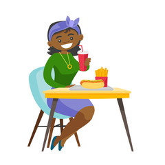 Canvas Print - Young african-american woman sitting at the table with soda, french fries and hot dog in fast food restaurant. Concept of unhealthy nutrition. Vector cartoon illustration isolated on white background.