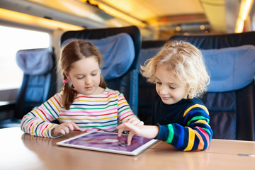 Kids travel by train. Railway trip with child.