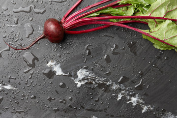 Wall Mural - Fresh harvested beetroot on stone background, top view