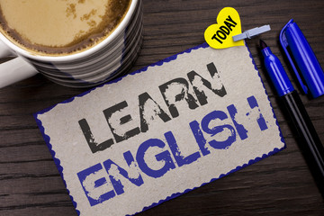 Poster - Conceptual hand writing showing Learn English. Business photo showcasing Study another Language Learn Something Foreign Communication written on Sticky Note wooden background Today Coffee Marker.