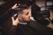 © Wavebreak Media - Man getting his hair trimmed with trimmer