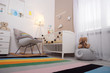 © New Africa - Cozy baby room interior with crib and rocking chair