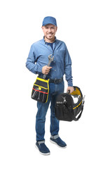 Plumber with set of tools on white background