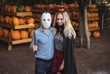 Couple Wearing Halloween Mask And Halloween Costume