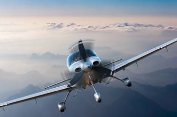 privat light airplane or aircraft fly on mountain background. vip travel concept