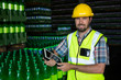© Wavebreak Media - Man with digital tablet standing in warehouse