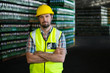 © Wavebreak Media - Young male worker standing in warehouse